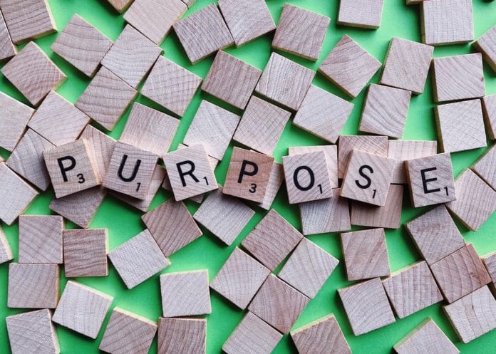 Purpose spelled in scrabble tiles